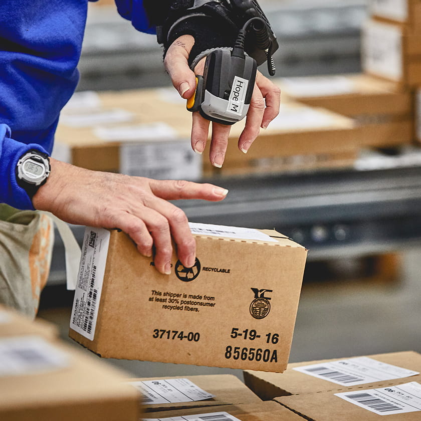 Warehouse worker scanning a package