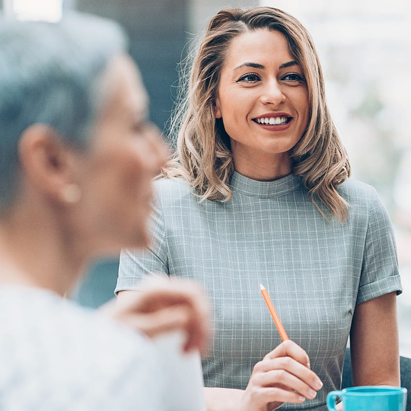 Woman smiling in a meeting