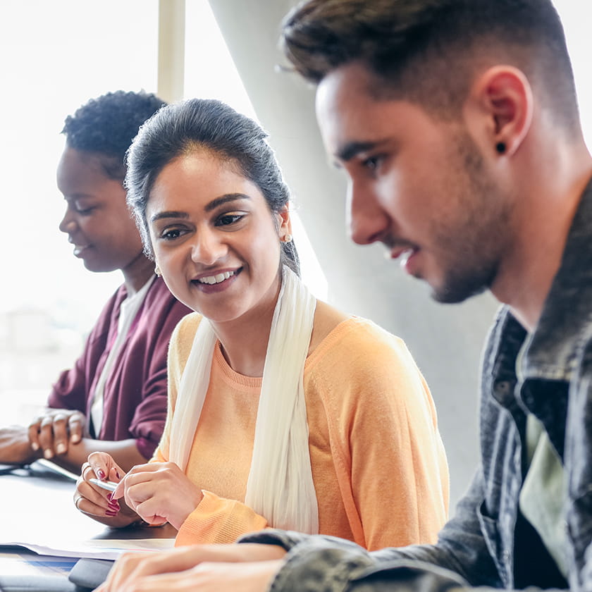 Young people collaborating at work