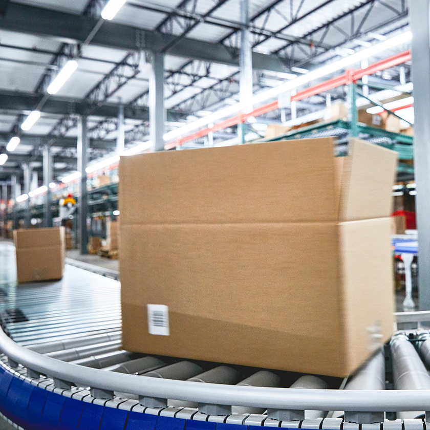 Box moving across a conveyor belt