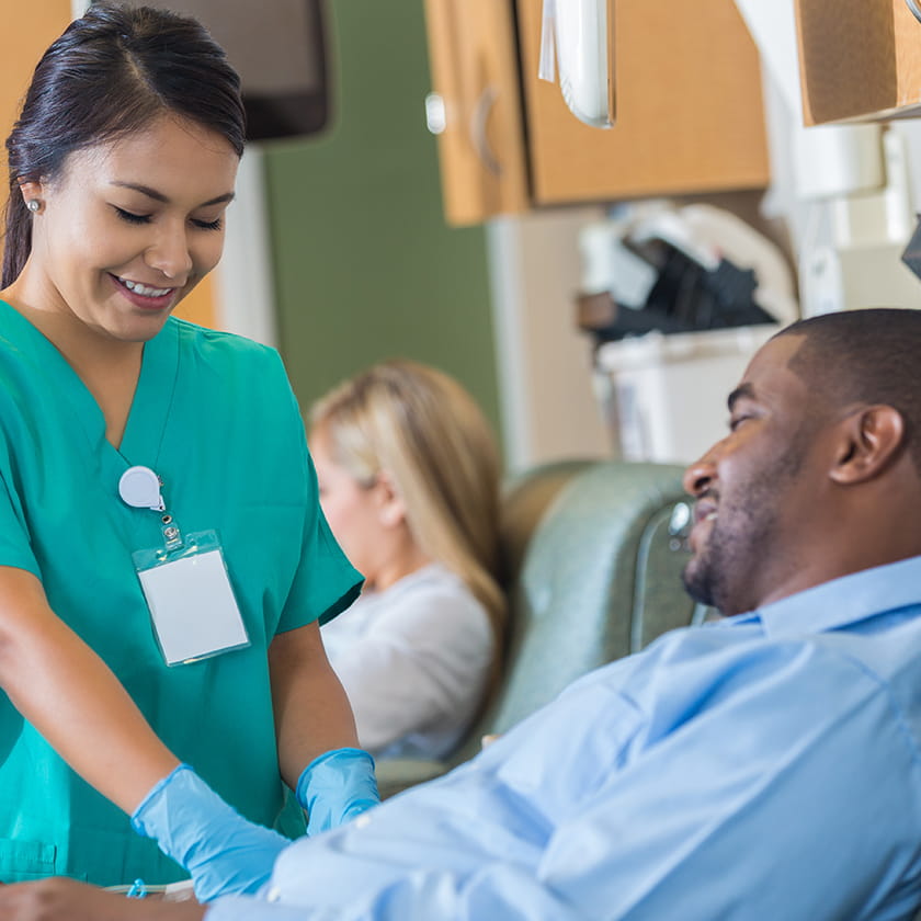 Nurse attending to a patient's arm