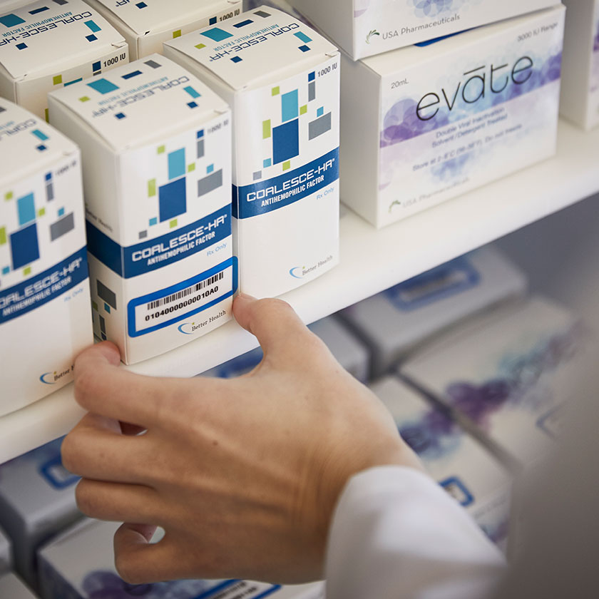 Pharmacist selecting a product from a shelf